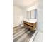 Updated bathroom with wood vanity, vessel sink, modern fixtures, and walk-in shower at 6849 Palomino Dr, Lakeland, FL 33811
