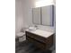 Modern bathroom with a floating vanity, vessel sink, and black framed medicine cabinet at 6849 Palomino Dr, Lakeland, FL 33811