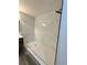Walk-in shower with marble-look tile and a white tile shower floor at 6849 Palomino Dr, Lakeland, FL 33811