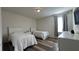 Cozy bedroom featuring two beds, wood-look floors, neutral paint and a wall-mounted TV at 720 Las Fuentes Dr, Kissimmee, FL 34746