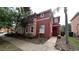Two story townhouse with a stucco exterior and well-kept landscaping at 720 Las Fuentes Dr, Kissimmee, FL 34746