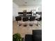 Open kitchen with granite counters, stainless appliances, and seating at the island at 720 Las Fuentes Dr, Kissimmee, FL 34746