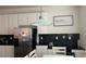 Eat-in kitchen with stainless steel appliances and white cabinetry at 720 Las Fuentes Dr, Kissimmee, FL 34746