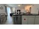 Open-concept kitchen showcasing a view into the dining and living areas at 720 Las Fuentes Dr, Kissimmee, FL 34746