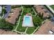 Aerial view of a community pool surrounded by townhomes and lush landscaping at 818 Park Lake Cir # 10, Maitland, FL 32751