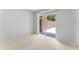 Bedroom features a sliding glass door to the patio, neutral carpet, and white walls at 818 Park Lake Cir # 10, Maitland, FL 32751