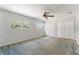Bright bedroom with ceiling fan, carpet, and two windows for natural light at 818 Park Lake Cir # 10, Maitland, FL 32751