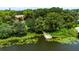 Waterfront property with a dock surrounded by lush vegetation at 818 Park Lake Cir # 10, Maitland, FL 32751