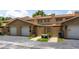 Home exterior showcasing attached garages, walkways, and landscaping at 818 Park Lake Cir # 10, Maitland, FL 32751