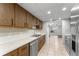 Bright galley kitchen with stainless steel appliances and wood cabinets at 818 Park Lake Cir # 10, Maitland, FL 32751