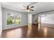 Living room featuring hardwood floors, ceiling fan, and a large window at 818 Park Lake Cir # 10, Maitland, FL 32751