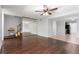 Open-concept living room with hardwood floors flowing to the kitchen at 818 Park Lake Cir # 10, Maitland, FL 32751
