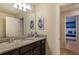 Bathroom featuring a granite countertop, vanity and a view into the Star Wars themed bedroom at 8801 Corcovado Dr, Kissimmee, FL 34747