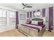 Bedroom with a silver bed frame, striped wall, and decorative mirror at 8801 Corcovado Dr, Kissimmee, FL 34747