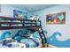 Charming bedroom with bunk beds featuring a Little Mermaid theme and vibrant color scheme at 8801 Corcovado Dr, Kissimmee, FL 34747