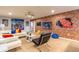 Fun game room with a lounge area, vibrant wall murals, and modern furniture at 8801 Corcovado Dr, Kissimmee, FL 34747