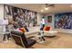 Entertaining game room with a lounge area, vibrant wall murals, and modern furniture at 8801 Corcovado Dr, Kissimmee, FL 34747