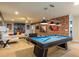 Fun game room with a pool table, colorful murals, and comfortable seating for entertainment at 8801 Corcovado Dr, Kissimmee, FL 34747