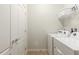 Laundry room with a white washer and dryer at 8801 Corcovado Dr, Kissimmee, FL 34747