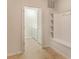 Mud room area with bench seating and access to the laundry room at 8801 Corcovado Dr, Kissimmee, FL 34747