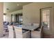 Covered patio with glass-top table and seating for outdoor dining and relaxation at 8801 Corcovado Dr, Kissimmee, FL 34747