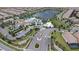 Aerial view of a Primary-planned community featuring a lake, clubhouse, pool, and well-manicured landscaping at 8801 Macapa Dr, Kissimmee, FL 34747