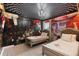 Bedroom with an Alice in Wonderland theme, decorative ceiling, and twin beds at 8801 Macapa Dr, Kissimmee, FL 34747