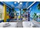 Bedroom with Minions-themed wallpaper, white twin beds and a window with yellow curtains at 8801 Macapa Dr, Kissimmee, FL 34747