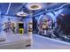 Immersive Star Wars themed game room with comfortable seating, vibrant murals, and a classic Pac-Personal arcade game at 8801 Macapa Dr, Kissimmee, FL 34747