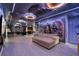 Large game room with Star Wars murals, sectional sofa, pool table, and kitchenette at 8801 Macapa Dr, Kissimmee, FL 34747