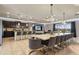 Open-concept great room with a sleek kitchen, dining area, and modern decor with views at 8801 Macapa Dr, Kissimmee, FL 34747