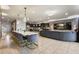 Open concept living and dining space with a large couch, breakfast bar, and lots of natural light at 8801 Macapa Dr, Kissimmee, FL 34747