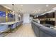 Spacious open concept living and dining space, stylish lighting, and modern furnishings at 8801 Macapa Dr, Kissimmee, FL 34747