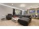 Open-concept living room with modern decor, sliding glass doors and open to the dining room at 8801 Macapa Dr, Kissimmee, FL 34747