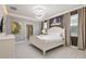Serene main bedroom with stylish decor, hardwood floors, and lots of natural light at 8801 Macapa Dr, Kissimmee, FL 34747