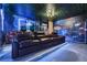 Amazing home theater with tiered seating, atmospheric lighting, and a immersive movie theme at 8801 Macapa Dr, Kissimmee, FL 34747
