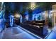 Home theater with tiered seating, large screen, and custom designed movie themed accents at 8801 Macapa Dr, Kissimmee, FL 34747