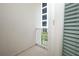 Balcony featuring white railing, sliding glass door, and view to green space at 922 Wild Date Ln, Lake Mary, FL 32746