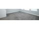 A bedroom features a bright window, light gray walls, and soft carpeting at 922 Wild Date Ln, Lake Mary, FL 32746