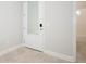 Hallway featuring a full glass door and bathroom with tub at 922 Wild Date Ln, Lake Mary, FL 32746