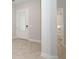 Hallway featuring a full glass door and bathroom with tub at 922 Wild Date Ln, Lake Mary, FL 32746
