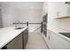 Stylish kitchen with white countertops, stainless steel appliances, island and modern cabinetry at 922 Wild Date Ln, Lake Mary, FL 32746