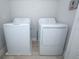 Bright laundry room with white washer and dryer at 922 Wild Date Ln, Lake Mary, FL 32746