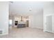 Spacious living room with sleek flooring, neutral color palette, and modern kitchen at 922 Wild Date Ln, Lake Mary, FL 32746