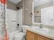 Cozy bathroom featuring a shower-tub combo and vanity with sink at 112 Lake Butler Ave, Haines City, FL 33844