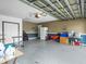Spacious garage featuring neutral paint and ample storage space for vehicles and household items at 112 Lake Butler Ave, Haines City, FL 33844