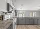 Updated kitchen with granite countertops and modern stainless steel appliances at 112 Lake Butler Ave, Haines City, FL 33844