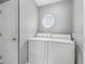 Dedicated laundry room features a standard washer and dryer setup at 112 Lake Butler Ave, Haines City, FL 33844