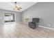 Comfortable living room with tiled floors and sliding glass doors to an outdoor patio at 112 Lake Butler Ave, Haines City, FL 33844
