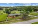 Beautiful aerial shot showcases the property's expansive land, fenced yard, and proximity to nature at 12434 Sullivan Rd, Clermont, FL 34715